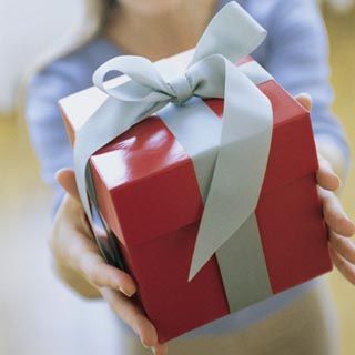 Woman Giving Gift, Portrait, Blurred.