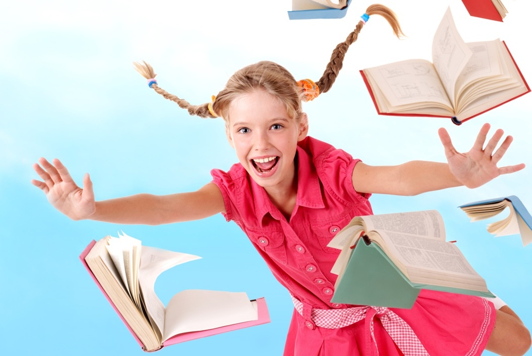 Schoolgirl  holding pile of books.